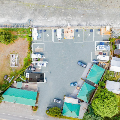 Aerial view highlighting Space 1 in a 12-space RV parking area.
